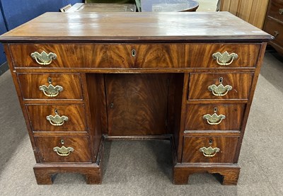Lot 361 - A Georgian mahogany knee hole desk with seven...