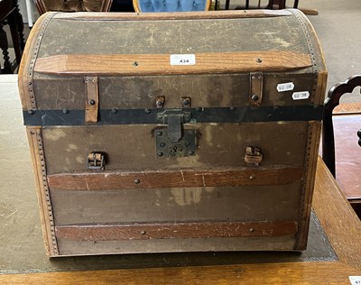 Lot 434 - A small dome topped travel trunk with fitted...