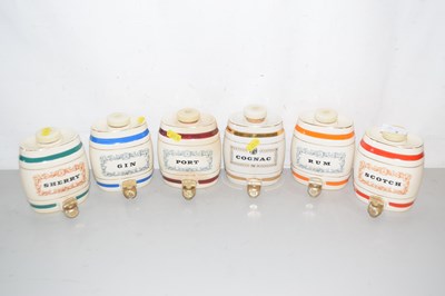 Lot 3 - A set of six Wade miniature spirit barrels