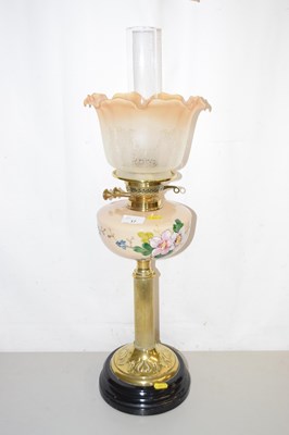 Lot 17 - A brass based oil lamp with opaque floral...