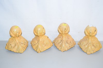 Lot 23 - A set of four cast iron bath feet