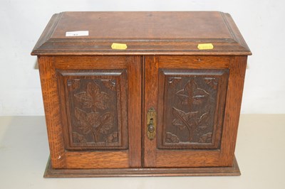 Lot 42 - Late Victorian oak smokers cabinet