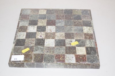 Lot 65 - A polished stone chess board