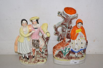 Lot 66 - A group of three Staffordshire figures