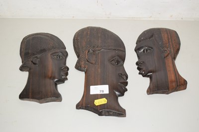 Lot 78 - Three African hardwood figural wall plaques