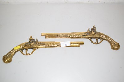 Lot 80 - A pair of brass mounted wall decorations...