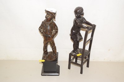 Lot 86 - A modern bronzed metal model of a girl on a...