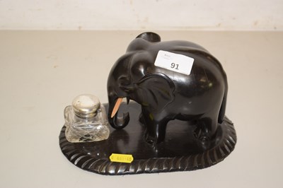 Lot 91 - A hardwood elephant ink well