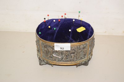 Lot 92 - A metal mounted pin cushion