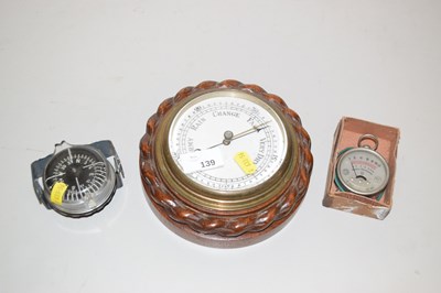 Lot 139 - A barometer in rope carved hardwood case, a...