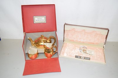 Lot 151 - A boxed Royal Worcester gold lustre tea set...
