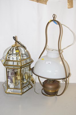 Lot 198 - A modern hanging lantern style lamp together...