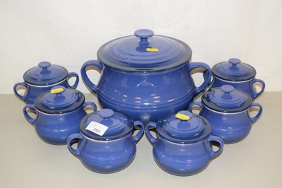 Lot 203 - A Le Creuset large bean pot together with a...