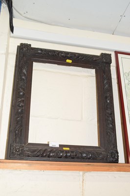 Lot 222 - A Victorian heavily carved picture frame