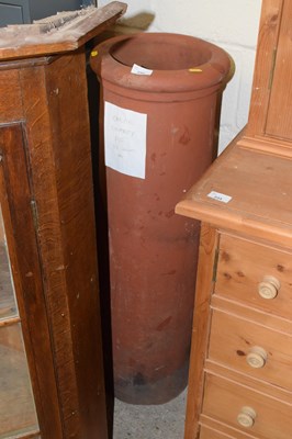 Lot 232 - A cannon terracotta chimney pot, 39" tall