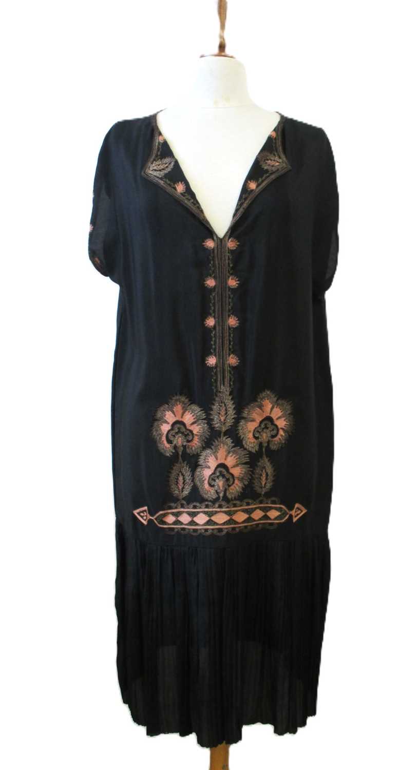 Lot 9 - An early 20th century shift dress, with v-neck...