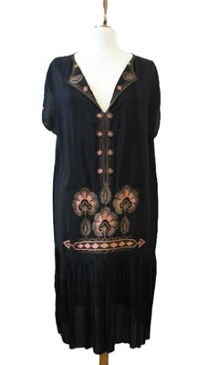 Lot 9 - An early 20th century shift dress, with v-neck...