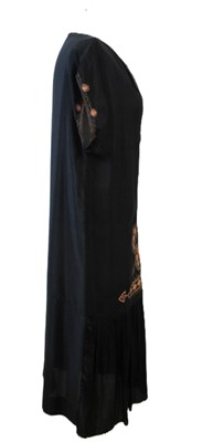 Lot 9 - An early 20th century shift dress, with v-neck...