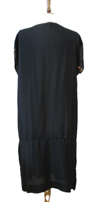 Lot 9 - An early 20th century shift dress, with v-neck...
