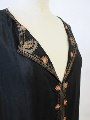 Lot 9 - An early 20th century shift dress, with v-neck...