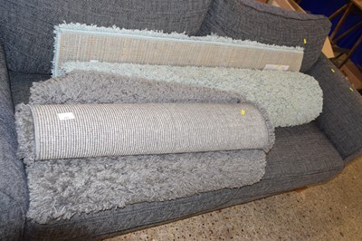Lot 291 - A Next shaggy pale blue rug together with two...