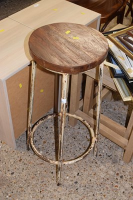Lot 293 - A hardwood and iron framed stool