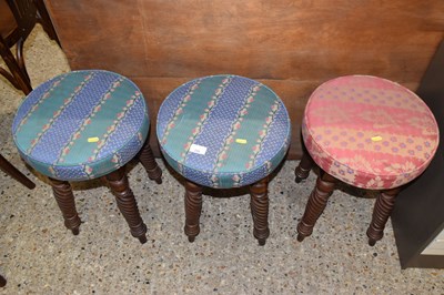 Lot 296 - A set of three circular topped stools on...