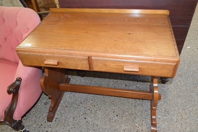 Lot 300 - A 20th Century oak veneered two drawer writing...