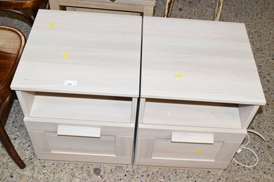 Lot 306 - A pair of modern light wood finish bedside...