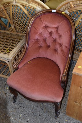 Lot 317 - A Victorian pink button back ladies armchair