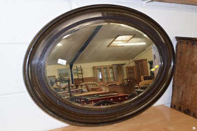 Lot 340 - An early 20th Century oval bevelled wall...