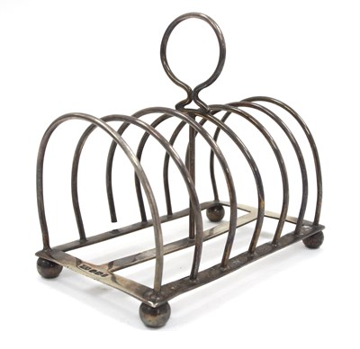 Lot 58 - A Victorian silver toast rack of seven...