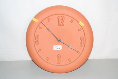 Lot 508 - A terracotta wall clock