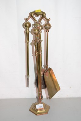 Lot 509 - A fire companion set