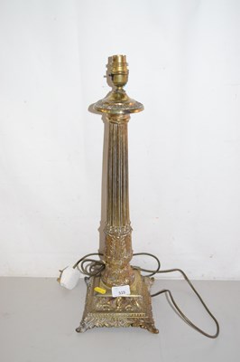 Lot 515 - A cast brass column formed table lamp