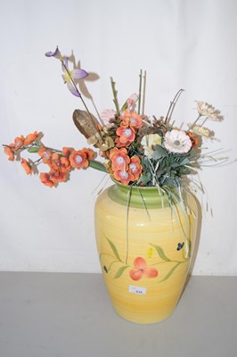 Lot 635 - A vase of fake flowers