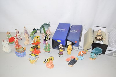 Lot 643 - A collection of various porcelain model fish,...