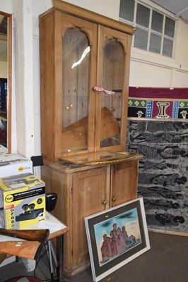 Lot 716 - A pine dresser with glazed doors and cupboards...