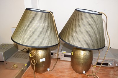 Lot 755 - A pair of gold globular table lamps with shades