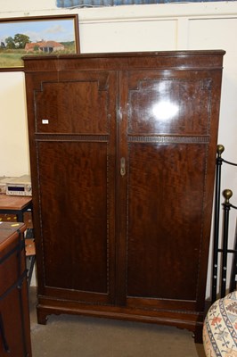 Lot 761 - A dark wood double door wardrobe