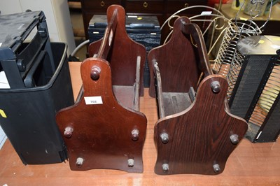 Lot 768 - A pair of dark wood magazine racks