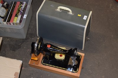 Lot 781 - A cased sewing machine