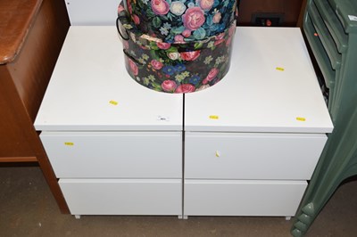 Lot 801 - A pair of white Ikea bedside tables
