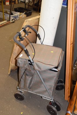 Lot 824 - A wheeled shopping trolley with check covering
