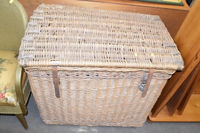 Lot 829 - A large wicker hamper with leather straps