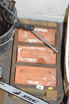 Lot 880 - A case of three vintage bricks marked...