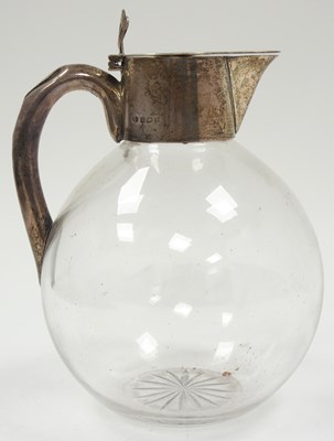 Lot 30 - A George V glass claret jug of baluster form...