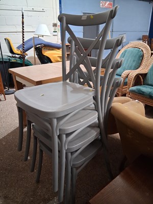 Lot 335A - A set of four stacking grey PVC chairs