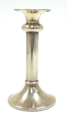 Lot 130 - An Elizabeth II single silver candle stick...