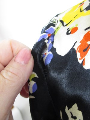 Lot 18 - A mid 20th century patterned black satin...